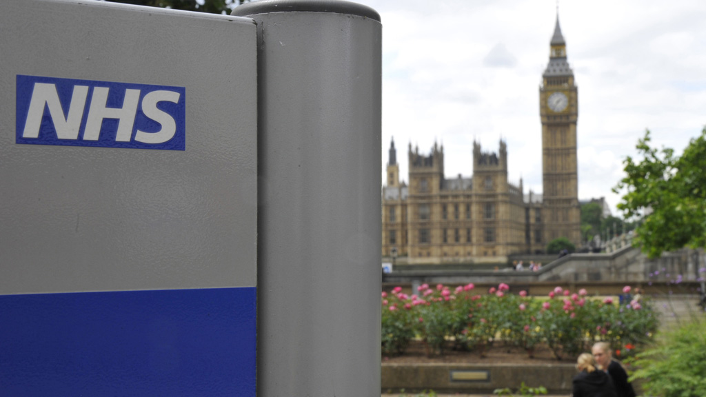 A NHS sign is seen in the grounds of St Thomas' Hospital in London